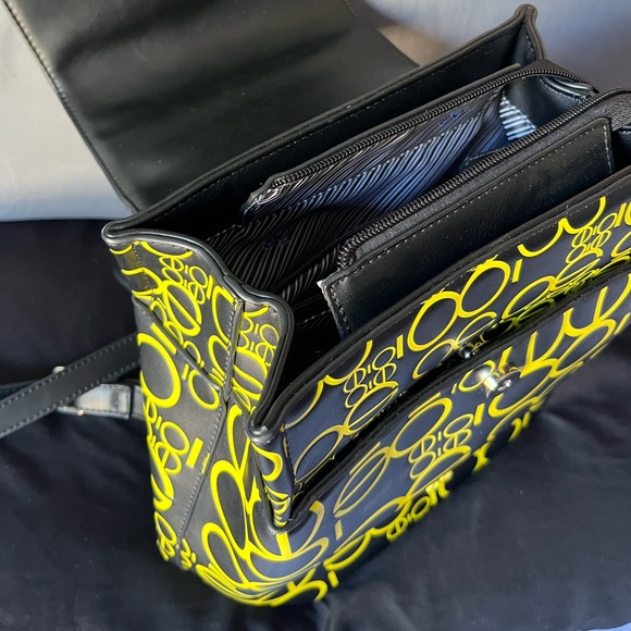 Cloe Backpack with Embossed Monogram Print in Yellow Color